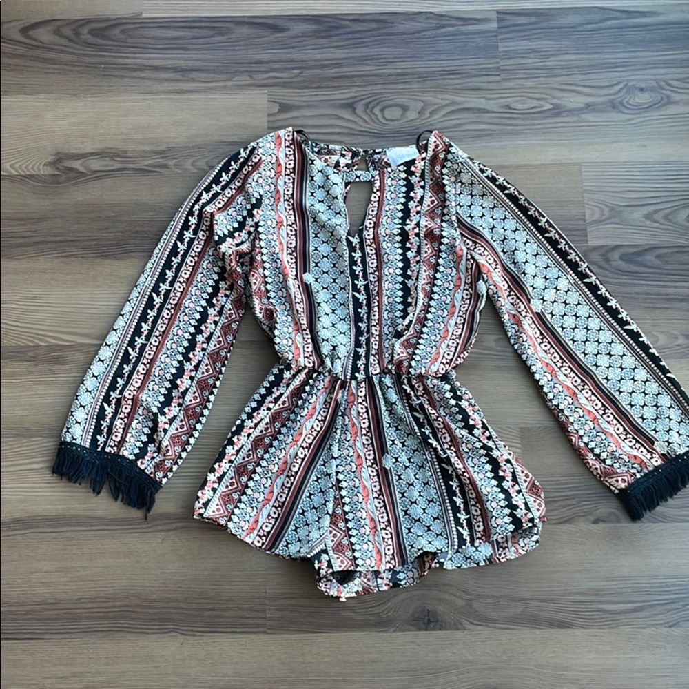 Coveted clothing romper with fringe sleeves